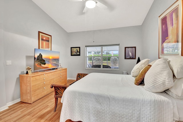 bedroom featuring lofted ceiling, ceiling fan, light wood finished floors, and baseboards