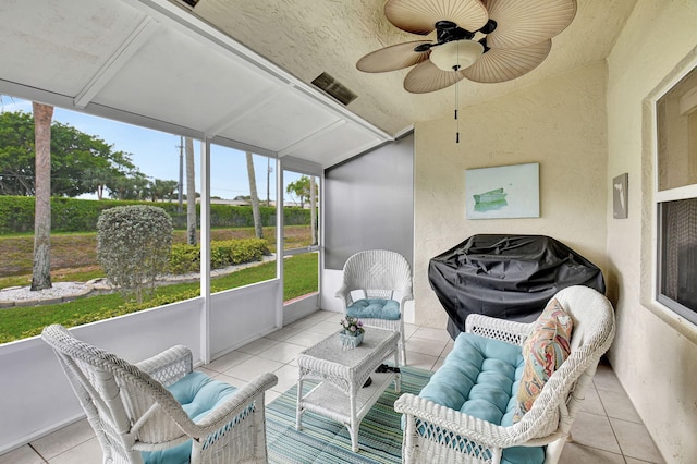 sunroom / solarium with plenty of natural light and a ceiling fan