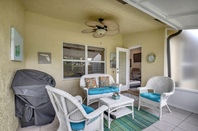 view of patio with grilling area and a ceiling fan