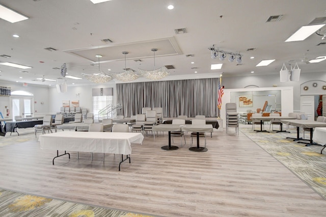 interior space with visible vents and wood finished floors