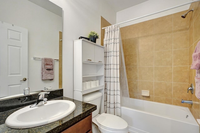 bathroom with shower / tub combo, vanity, and toilet