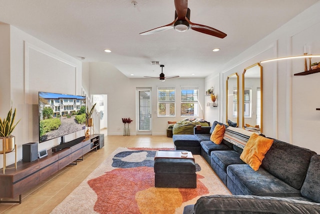 living room featuring light tile patterned floors, baseboards, visible vents, and recessed lighting