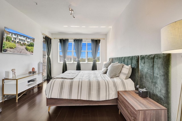 bedroom featuring wood finished floors