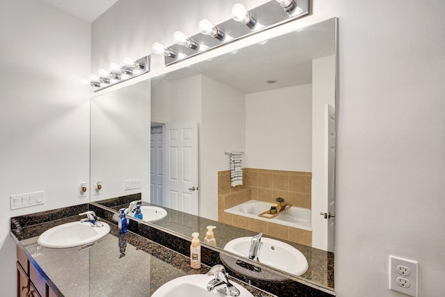 bathroom with a sink and a bath