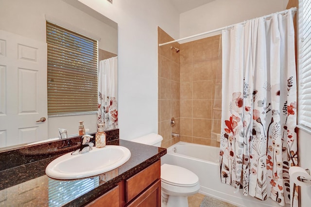 full bathroom with shower / bathtub combination with curtain, toilet, and vanity