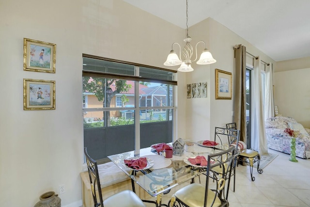 dining area with an inviting chandelier