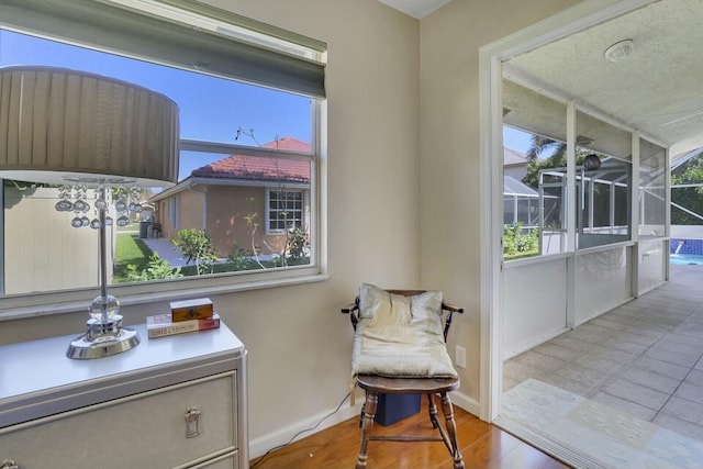 sitting room featuring a wealth of natural light and baseboards