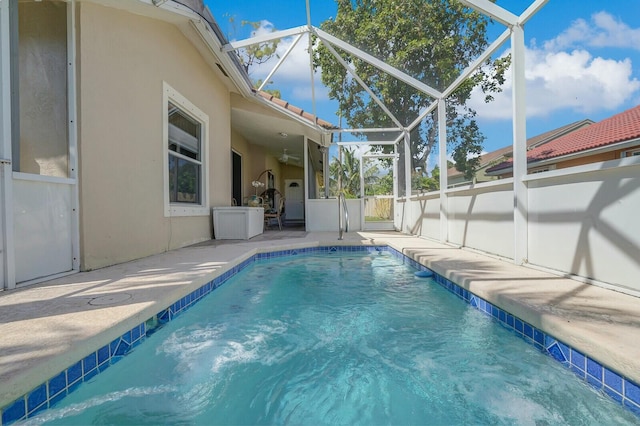 view of pool featuring a lanai, a patio area, and a fenced in pool