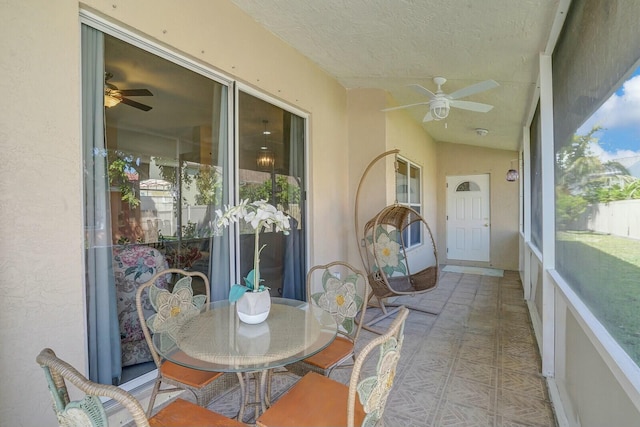 sunroom / solarium with vaulted ceiling and ceiling fan