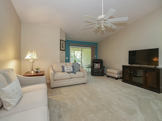 living room with carpet flooring, ceiling fan, and vaulted ceiling