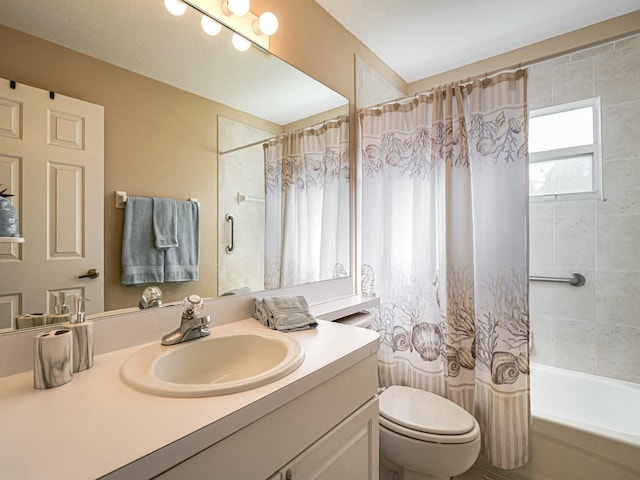 bathroom with toilet, vanity, and shower / bathtub combination with curtain