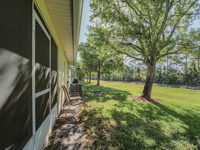 view of yard featuring central AC unit