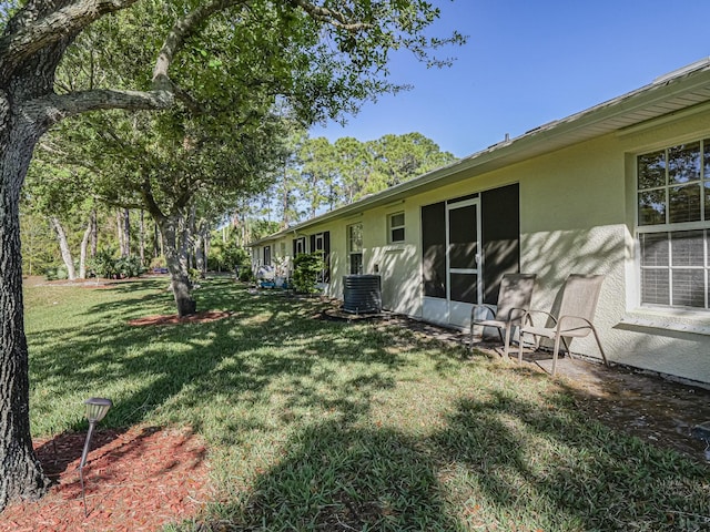 view of yard featuring central AC