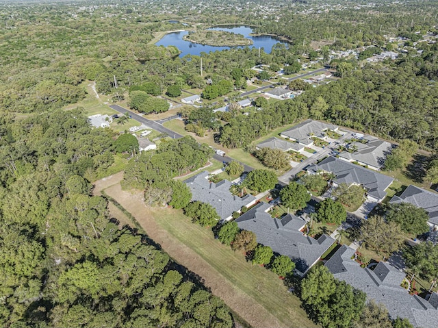 drone / aerial view with a residential view and a water view