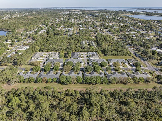 drone / aerial view with a residential view and a water view