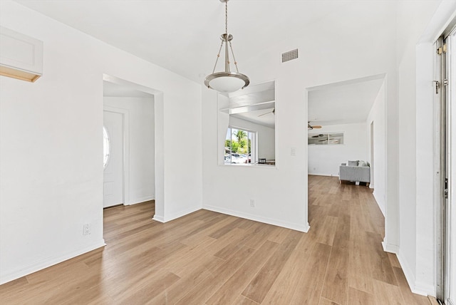 6560 Hayes St, Hollywood, FL 33024 - unfurnished dining area featuring light wood-style floors, baseboards, and visible vents