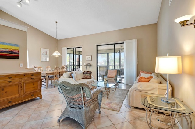 living room with lofted ceiling and light tile patterned flooring