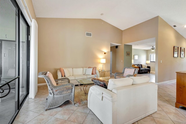 living room featuring light tile patterned floors, lofted ceiling, visible vents, ceiling fan, and baseboards