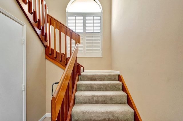 stairs featuring baseboards