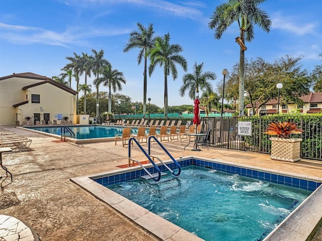 pool featuring a patio and fence