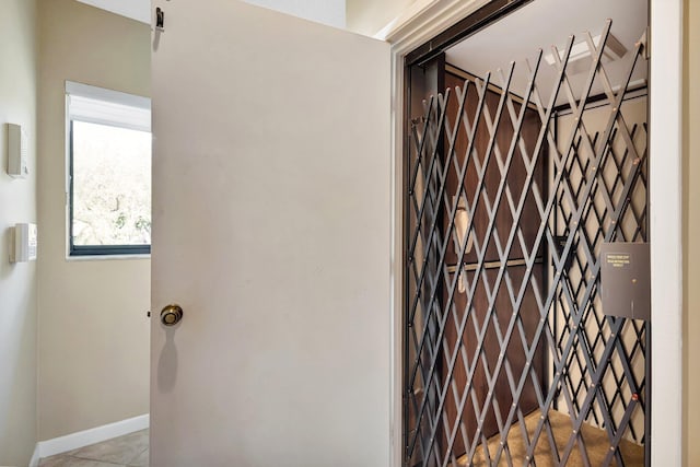 interior space featuring baseboards