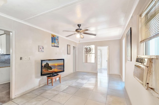 living area featuring ceiling fan, ornamental molding, baseboards, and light tile patterned flooring