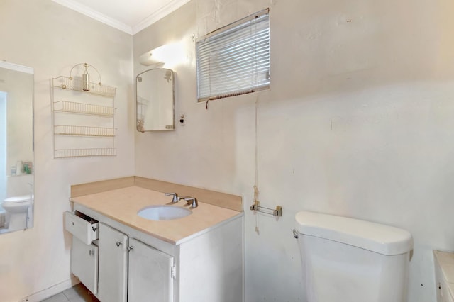 bathroom featuring ornamental molding, vanity, and toilet