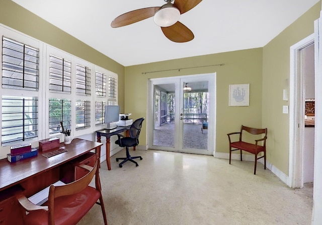 office area with a ceiling fan and baseboards