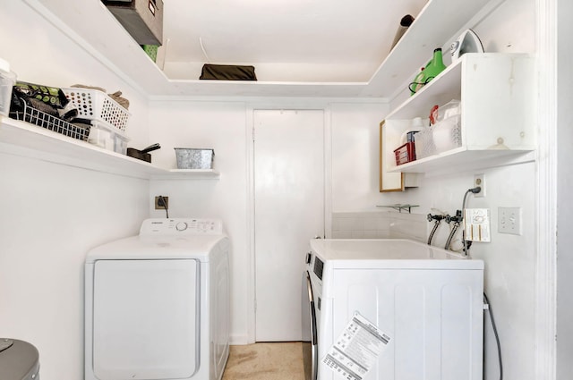 washroom featuring laundry area and washer and dryer