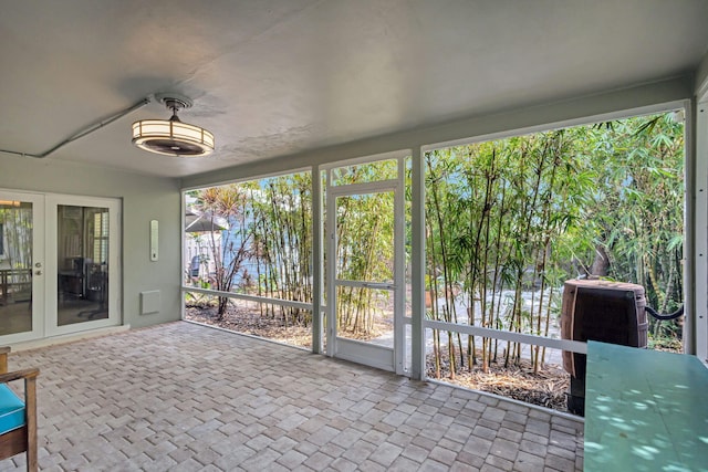 unfurnished sunroom featuring french doors