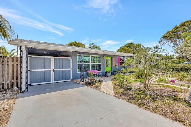 view of front of property with fence and stucco siding