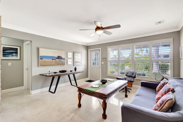 home office featuring a ceiling fan, visible vents, crown molding, and baseboards