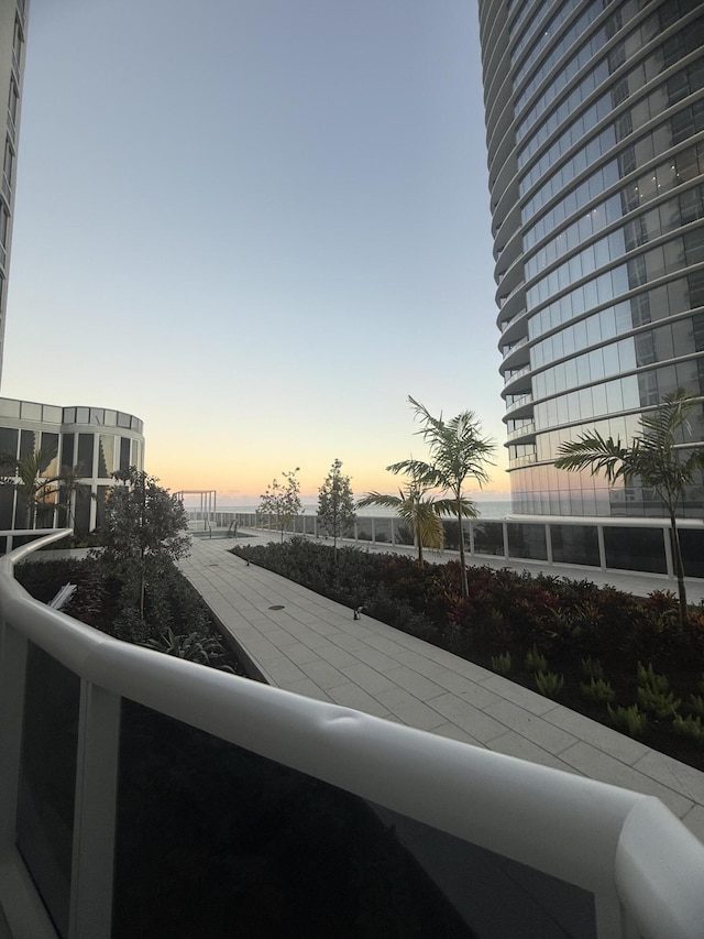 view of balcony at dusk