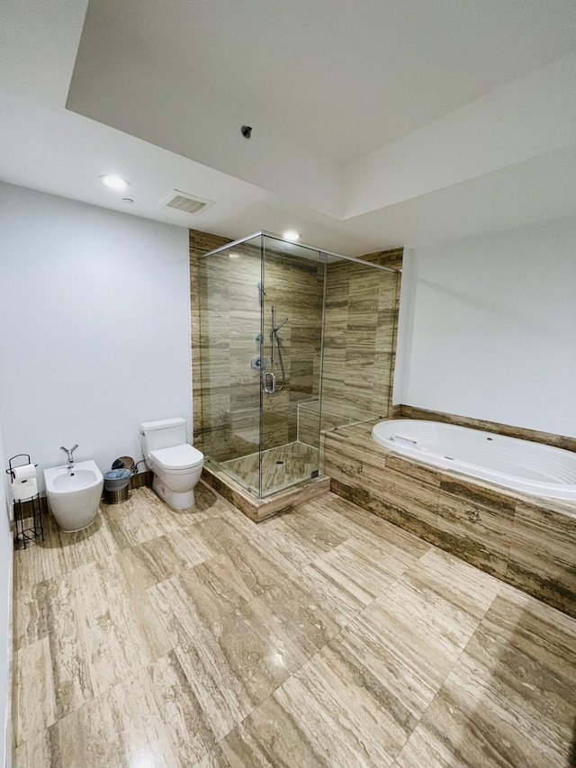 full bathroom featuring toilet, visible vents, a shower stall, a bath, and a bidet