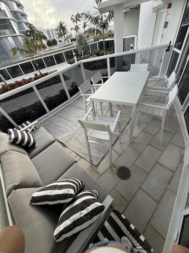 view of patio featuring a balcony