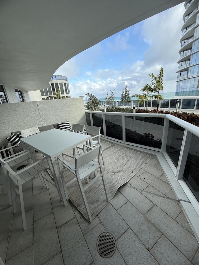 balcony with outdoor dining area