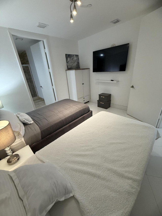 tiled bedroom with visible vents