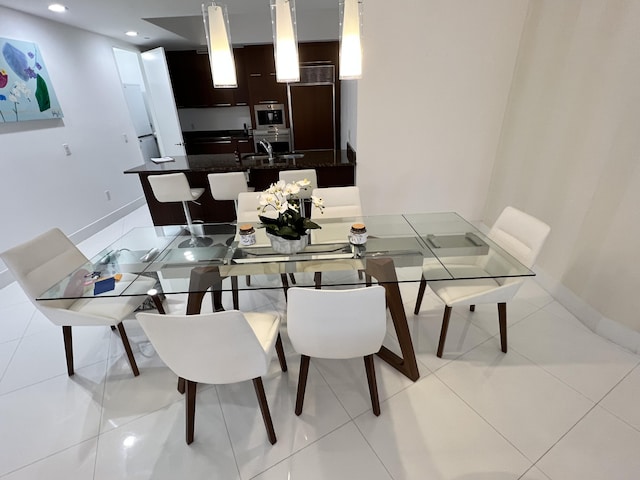 dining area with recessed lighting, baseboards, and light tile patterned floors