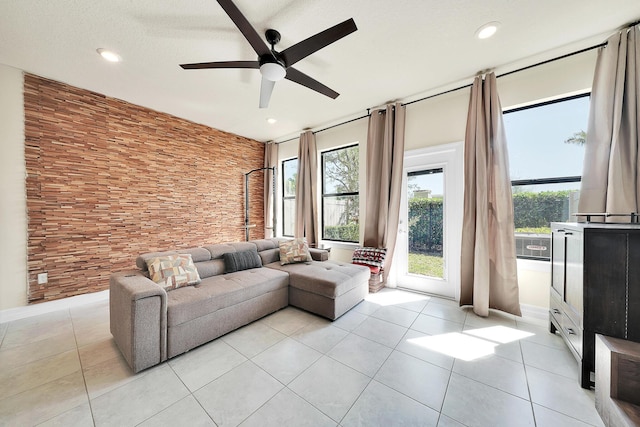 living room with light tile patterned floors, recessed lighting, and ceiling fan