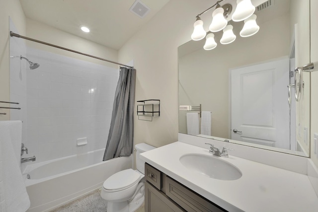 bathroom featuring visible vents, vanity, toilet, and shower / tub combo