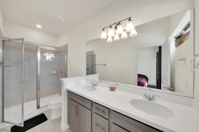 ensuite bathroom featuring a shower stall, ensuite bath, toilet, and a sink