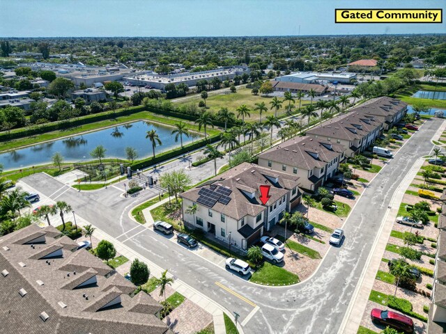 aerial view with a residential view and a water view