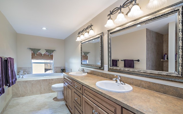 bathroom with a bath, double vanity, a sink, and tile patterned floors