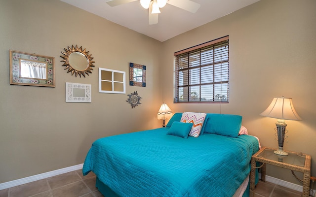 bedroom featuring ceiling fan, baseboards, and tile patterned floors