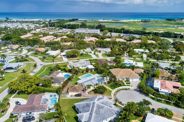 bird's eye view featuring a water view and a residential view