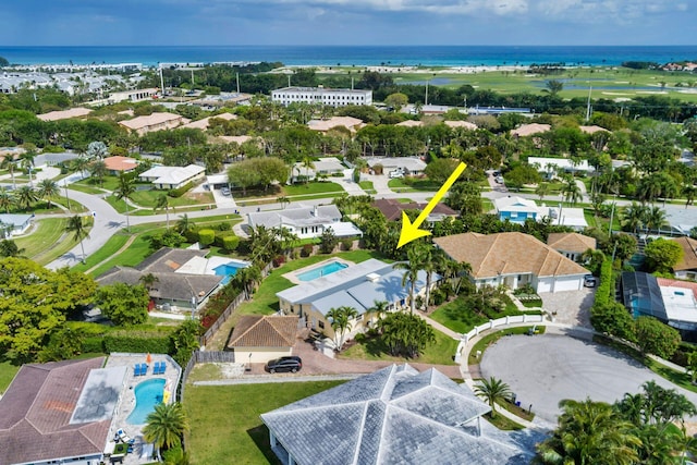 birds eye view of property featuring a water view