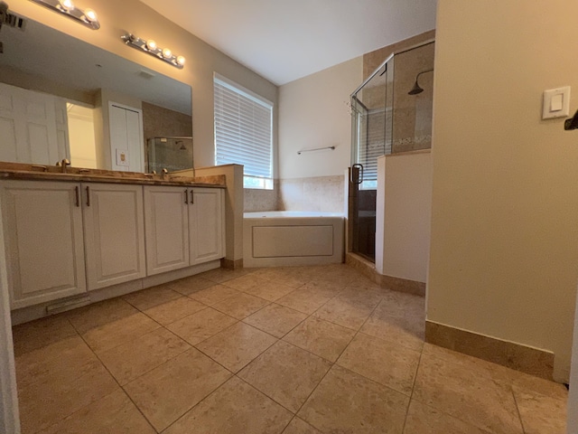 full bath with tile patterned flooring, visible vents, a bath, double vanity, and a stall shower