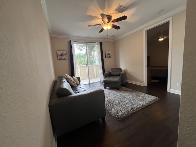 living area featuring baseboards, visible vents, ceiling fan, ornamental molding, and dark wood-type flooring