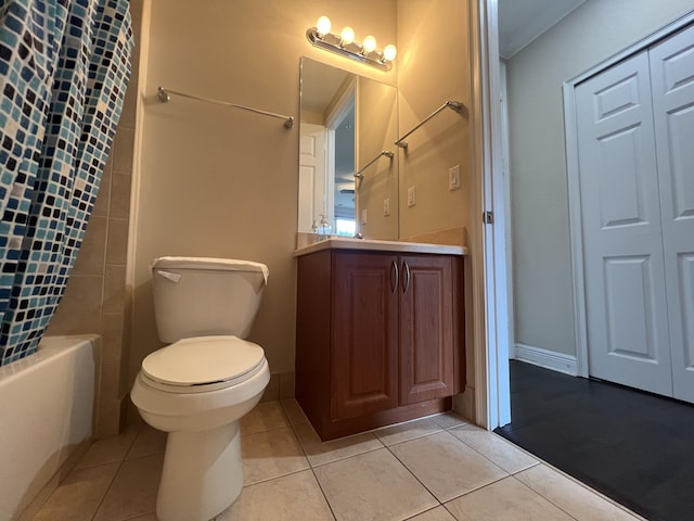 full bathroom with shower / tub combo, baseboards, toilet, tile patterned floors, and vanity