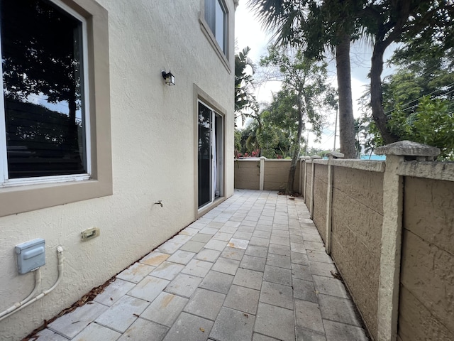 view of patio featuring fence